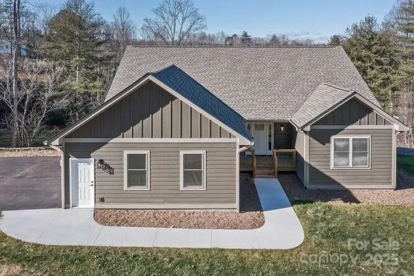 a house with trees in the background