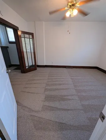 a kitchen with wooden floors and a sink