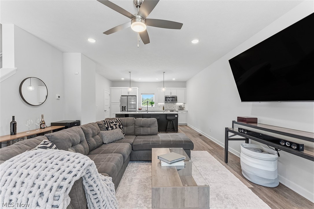 2308 Fulton Road Cleveland, OH 44113 - Photo 5 of 30 Open-concept living area with wood-finish flooring, recessed lighting, and a ceiling fan