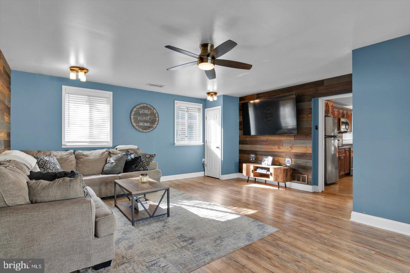 306 East Rudderow Avenue Maple Shade, NJ 08052 - Photo 17 of 38 a living room with furniture and a flat screen tv with kitchen view