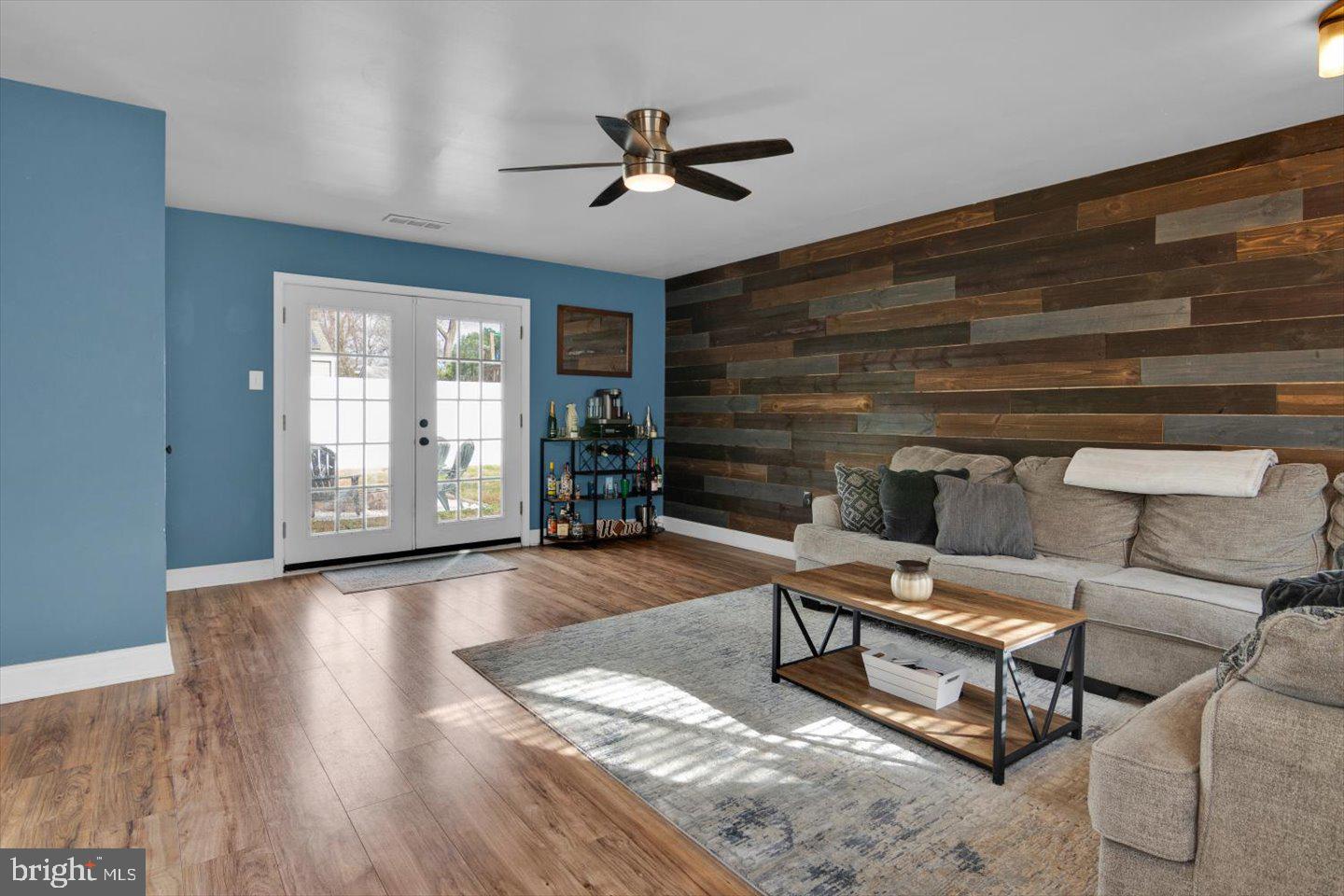 306 East Rudderow Avenue Maple Shade, NJ 08052 - Photo 18 of 38 a living room with furniture a ceiling fan and a rug