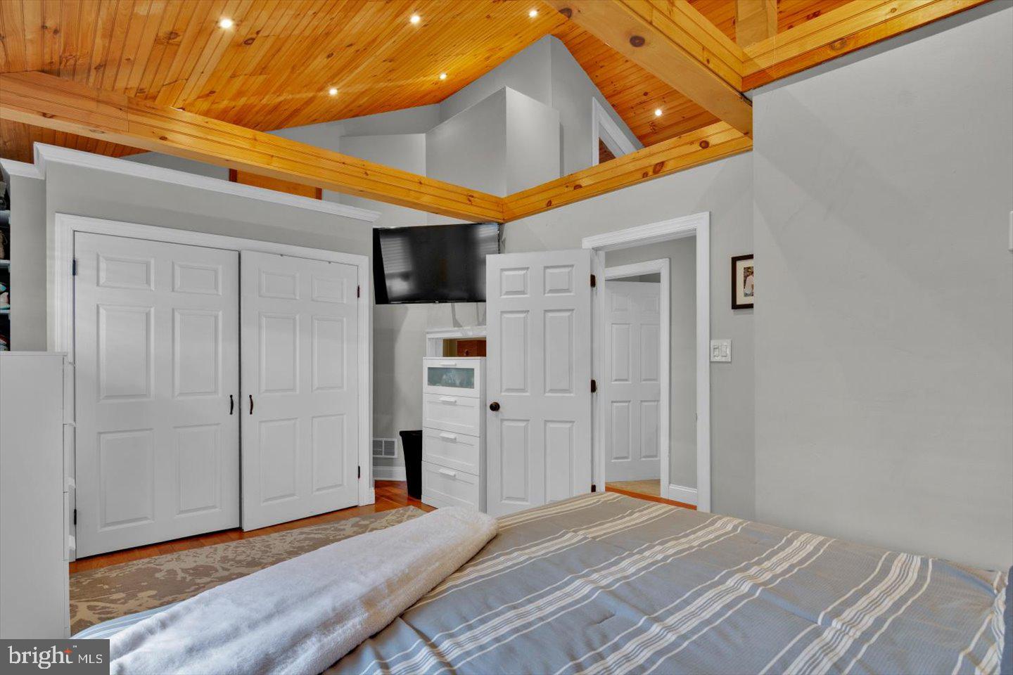 306 East Rudderow Avenue Maple Shade, NJ 08052 - Photo 23 of 38 a bedroom with a bed and wooden floor
