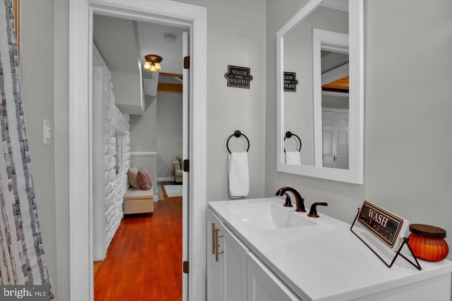 306 East Rudderow Avenue Maple Shade, NJ 08052 - Photo 29 of 38 a bathroom with a sink and a mirror