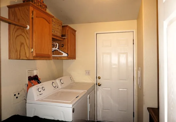 a utility room with dryer and washer