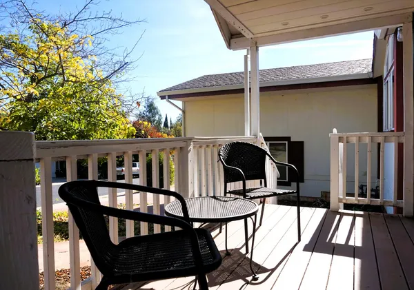 a view of a balcony with chairs