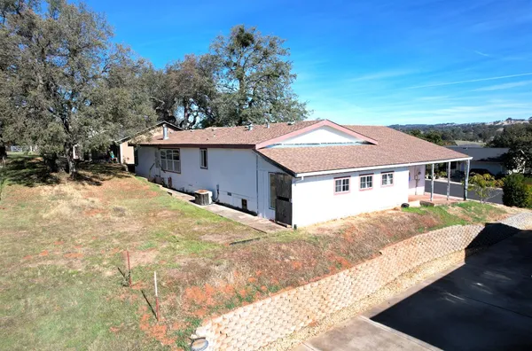 a house with trees in the background