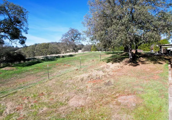 a view of a lake with a yard