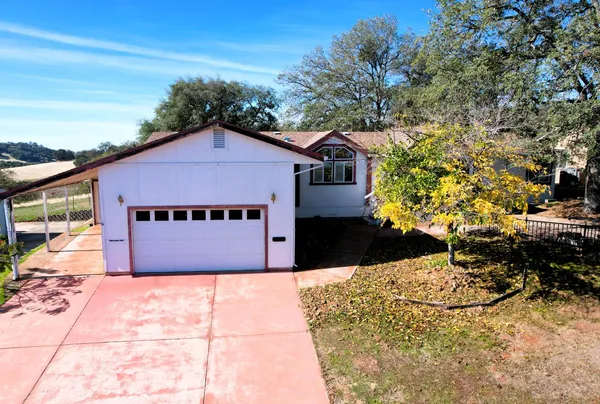 a house view with a garden space
