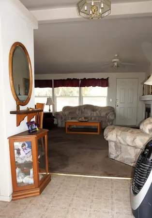 a view of living room with furniture and floor to ceiling window