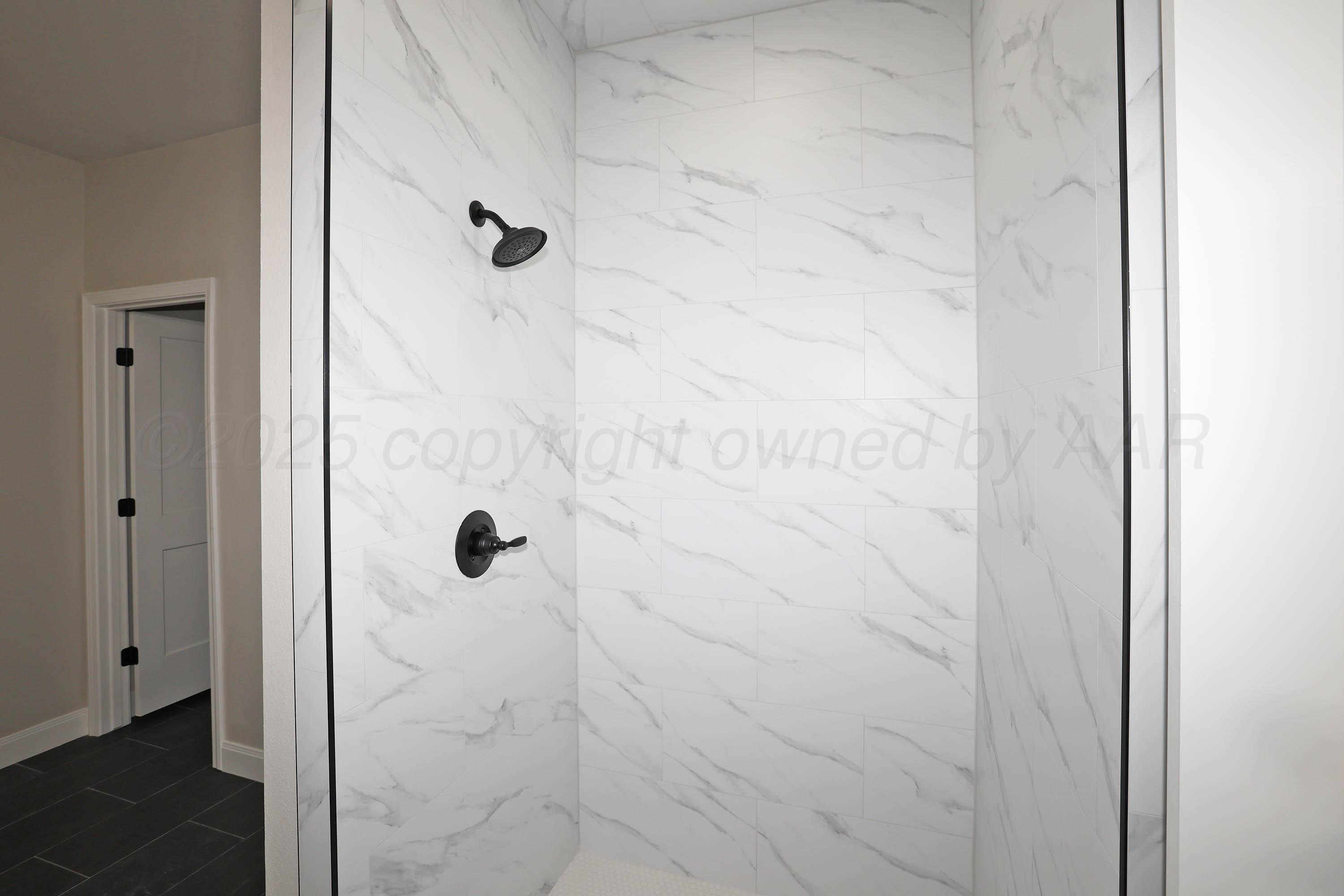 18150 Mid-Country Boulevard Amarillo, TX 79119 - Photo 13 of 25 a bathroom with a shower