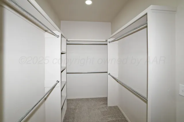 a view of an empty walk in closet