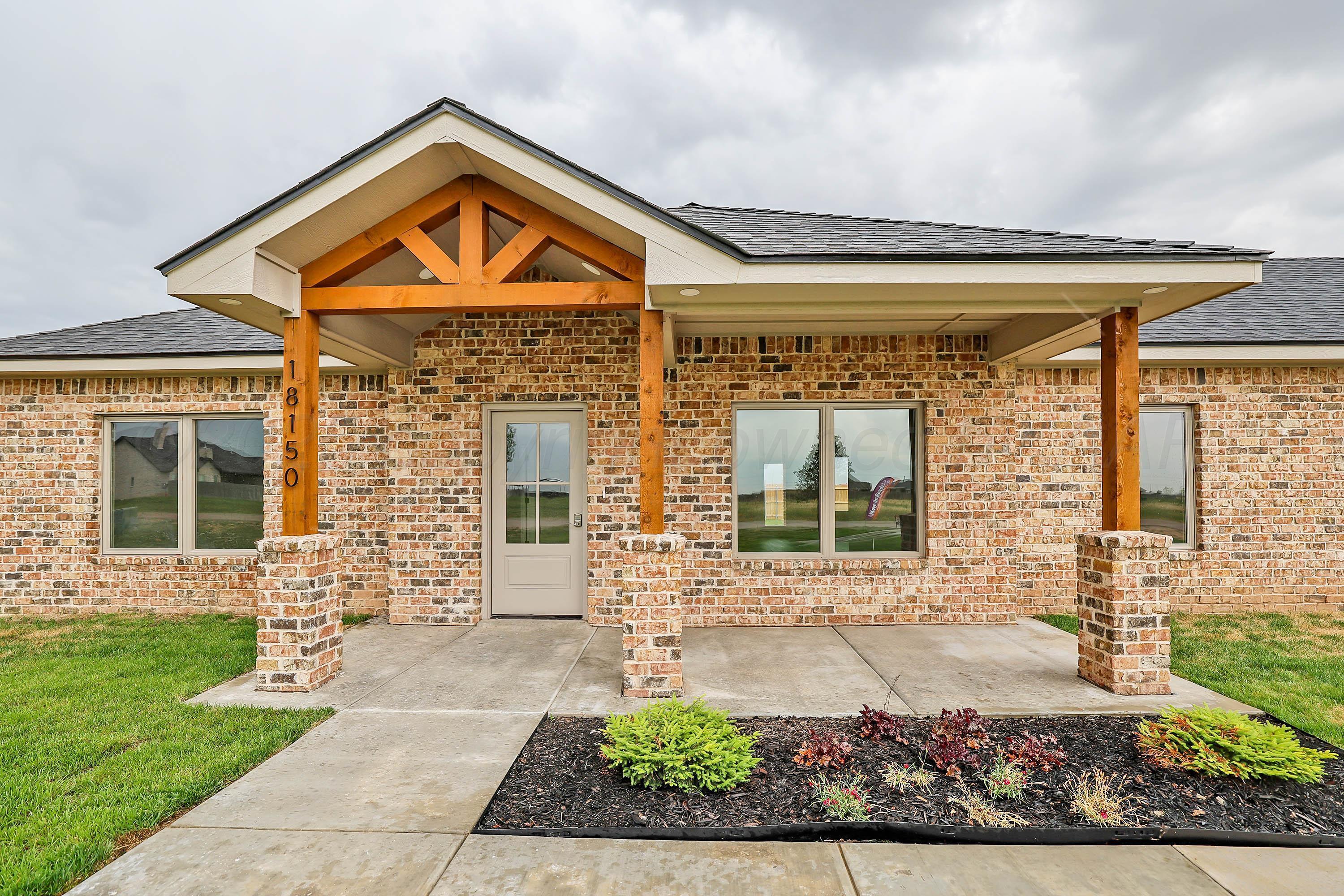 18150 Mid-Country Boulevard Amarillo, TX 79119 - Photo 2 of 25 front view of a house with a yard