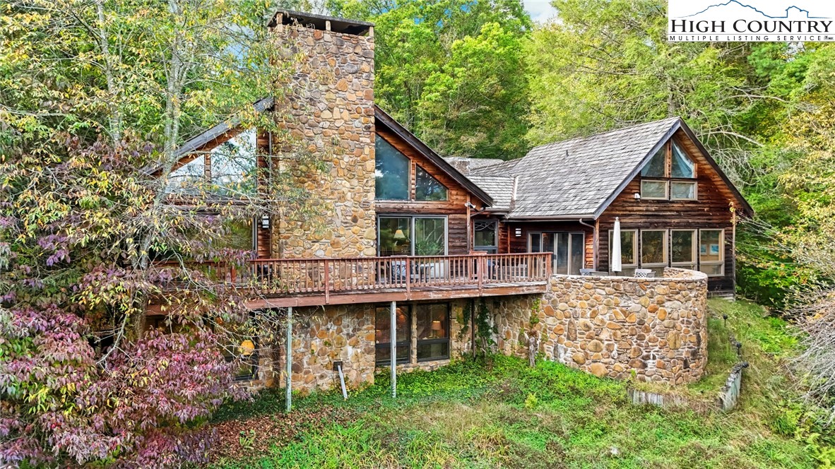 423 Beaver Dam Farm Road Vilas, NC 28692 - Photo 2 of 15 a front view of a house with garden