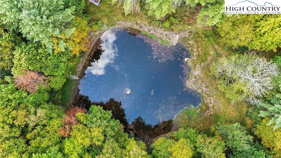 423 Beaver Dam Farm Road Vilas, NC 28692 - Photo 10 of 15 an aerial view of a house with a yard