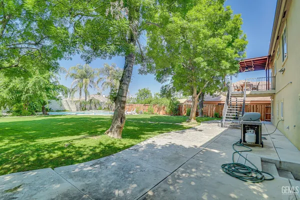 a backyard of a house with lots of green space