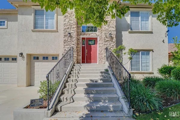 a view of front door and potted plants