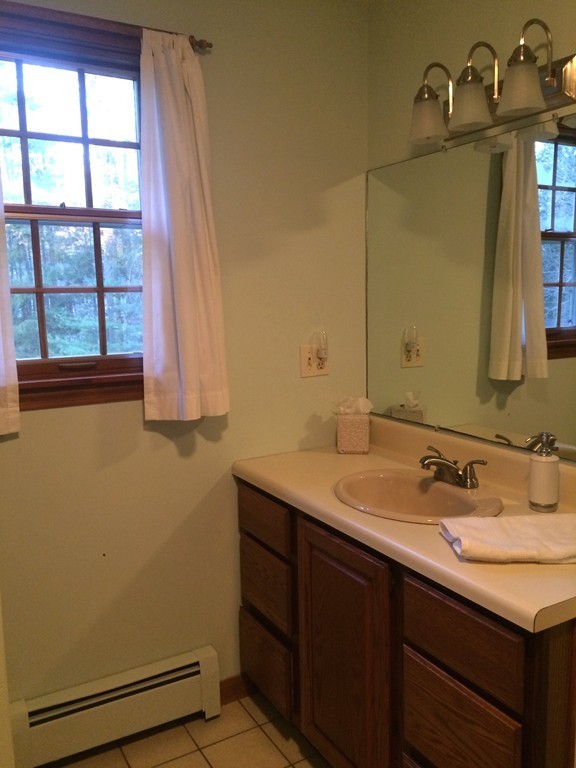 79 Strong Road Southampton, MA 01073 - Photo 23 of 30 a bathroom with a sink and a mirror