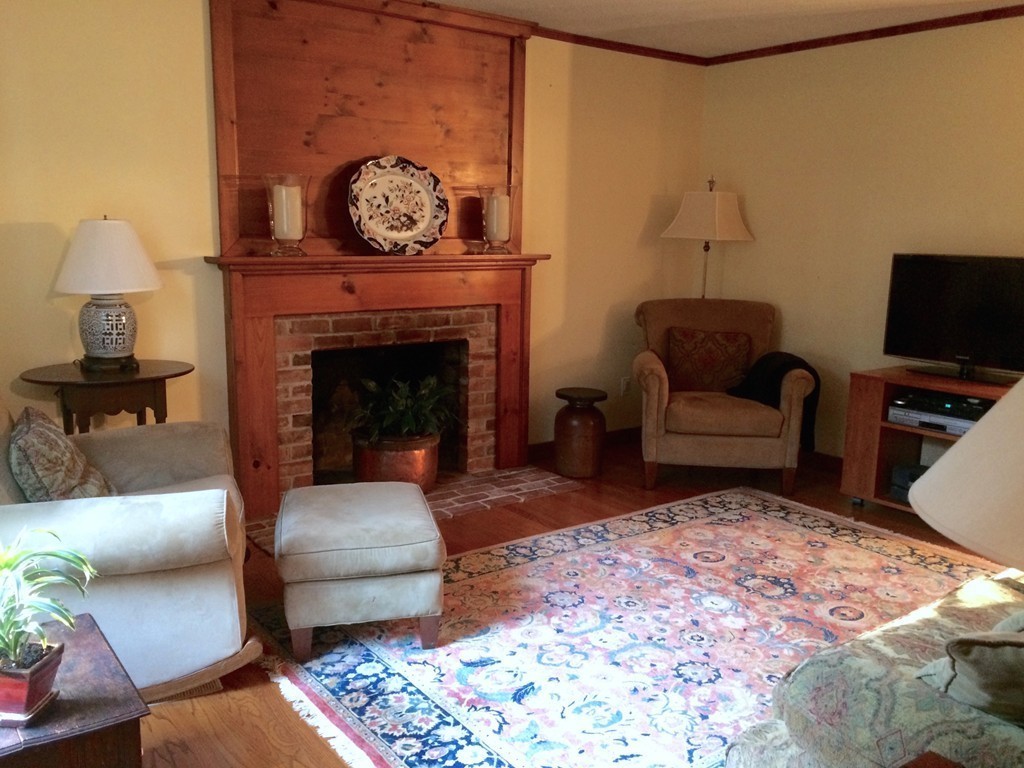 79 Strong Road Southampton, MA 01073 - Photo 10 of 30 a living room with furniture and a fireplace