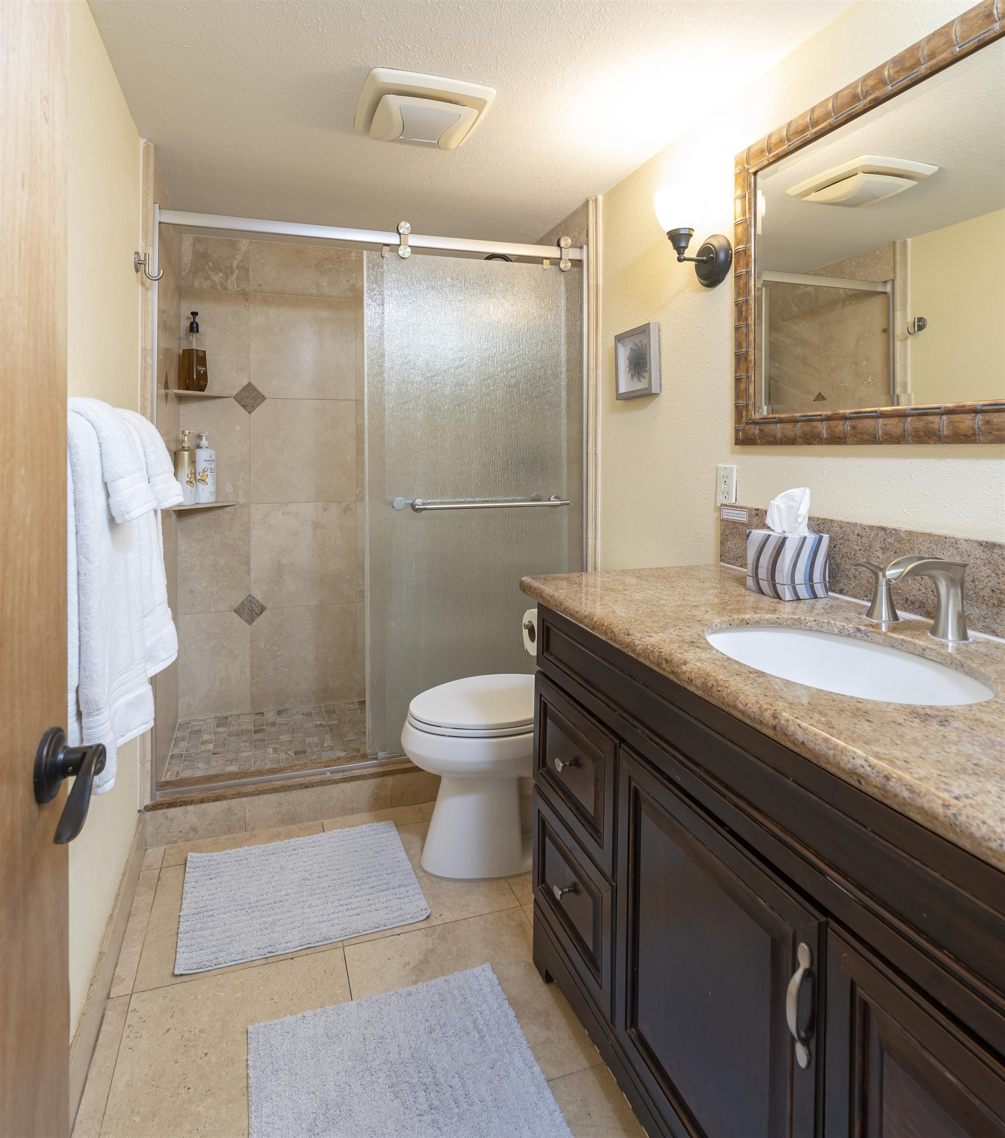 2495 South Kihei Road, Unit 137 Kihei, HI 96753 - Photo 11 of 17 a spacious bathroom with a granite countertop sink toilet and shower