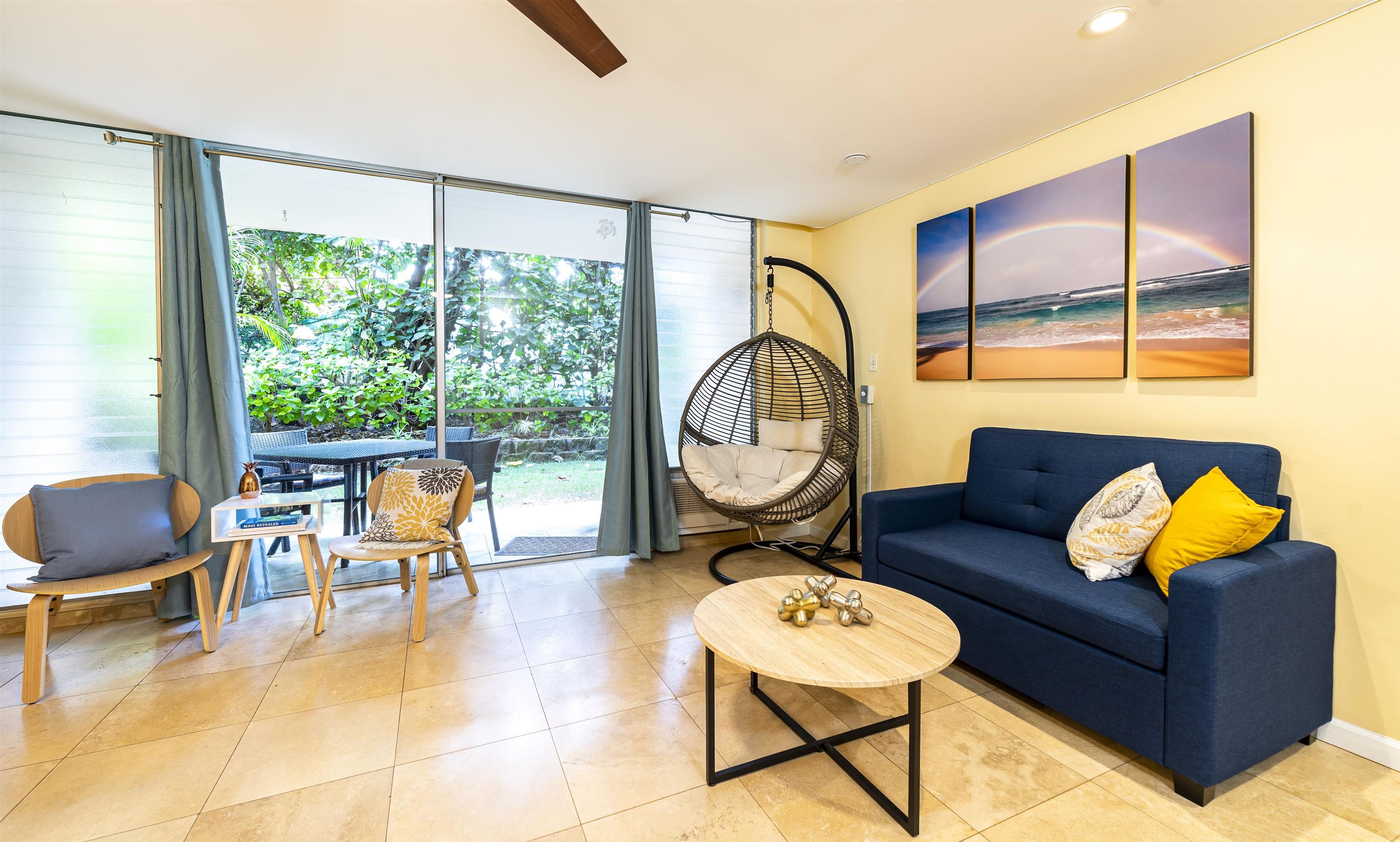 2495 South Kihei Road, Unit 137 Kihei, HI 96753 - Photo 2 of 17 a living room with furniture and a floor to ceiling window