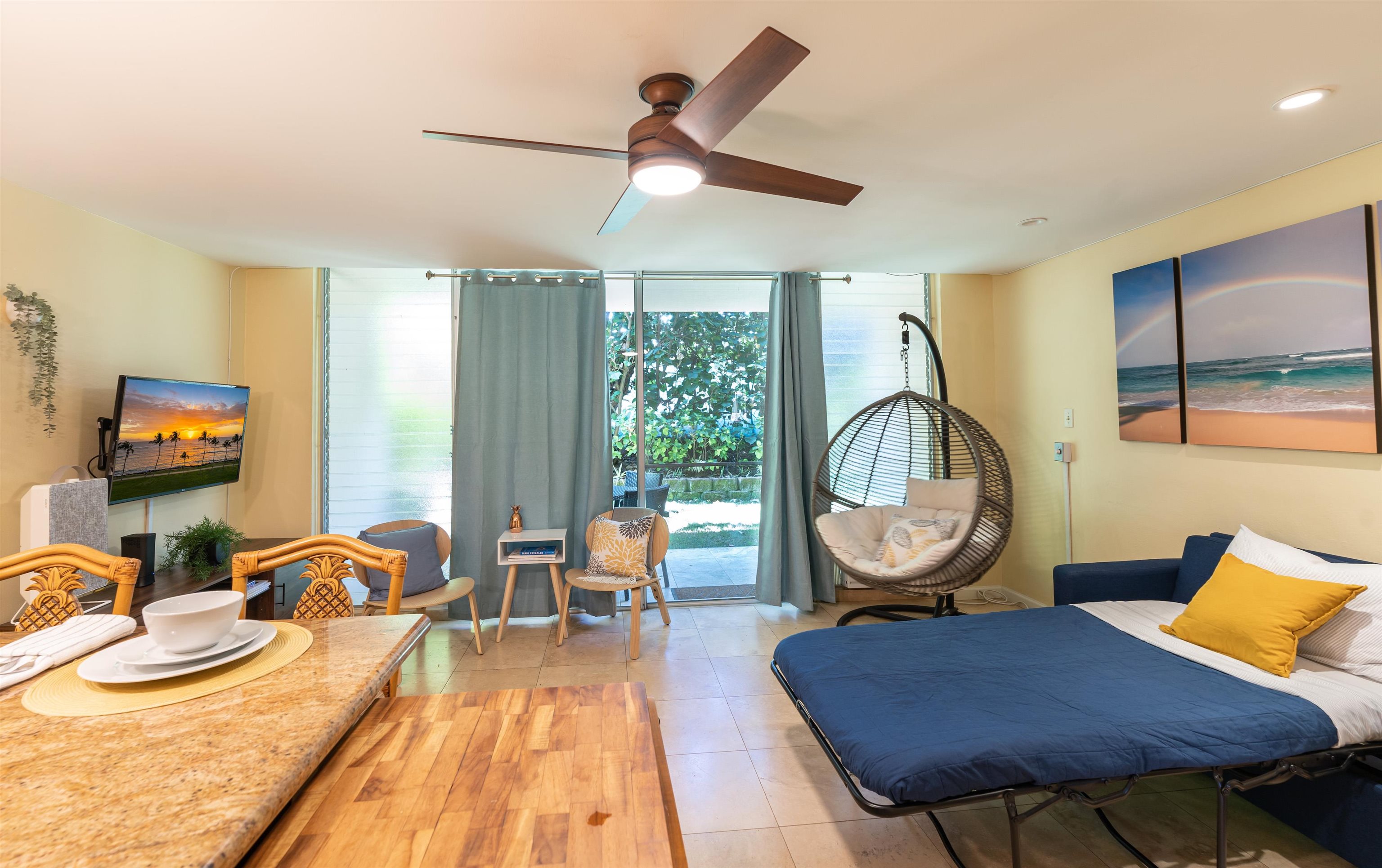2495 South Kihei Road, Unit 137 Kihei, HI 96753 - Photo 3 of 17 a living room with furniture a rug and a large window