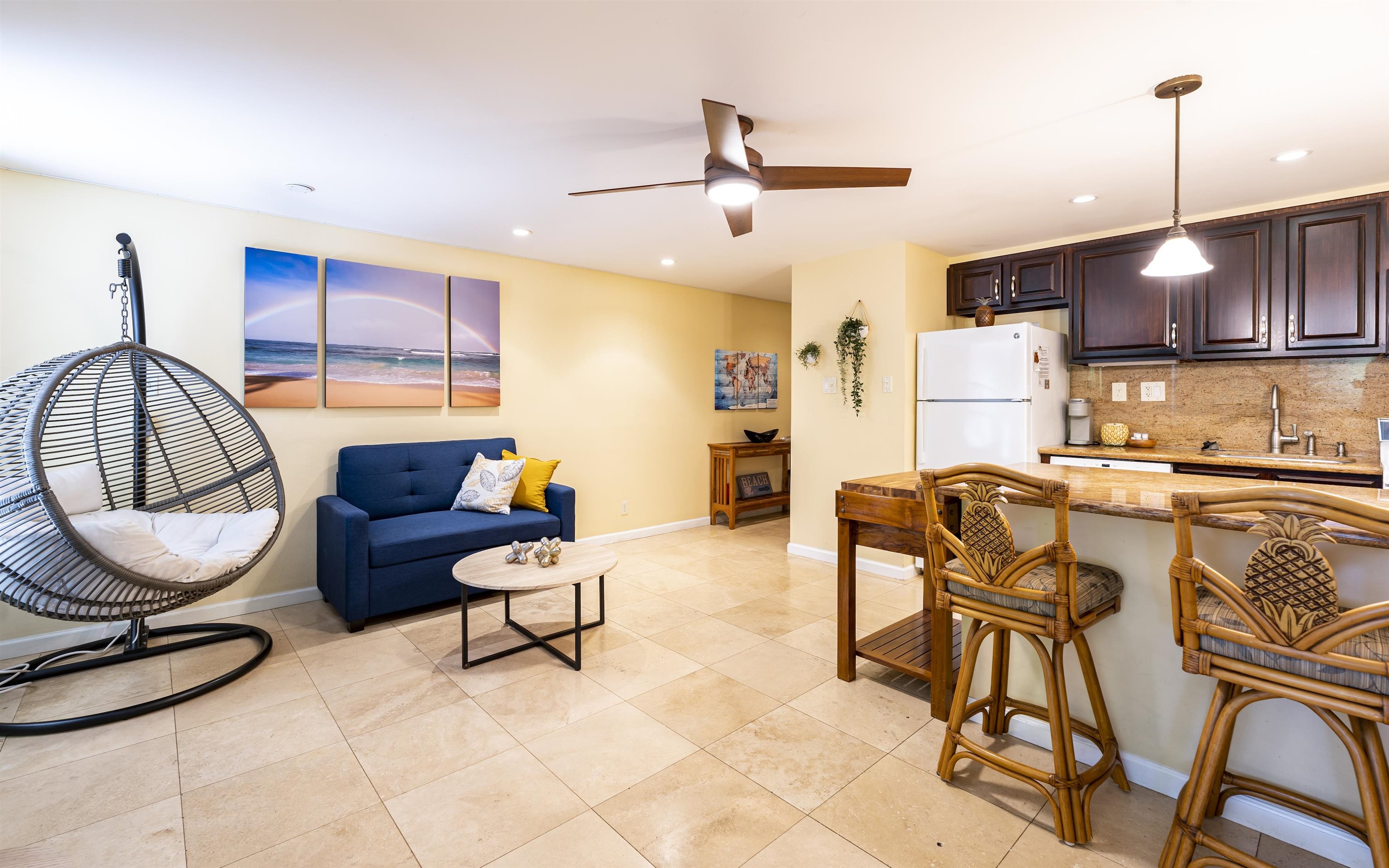 2495 South Kihei Road, Unit 137 Kihei, HI 96753 - Photo 4 of 17 a living room with furniture a rug and white walls