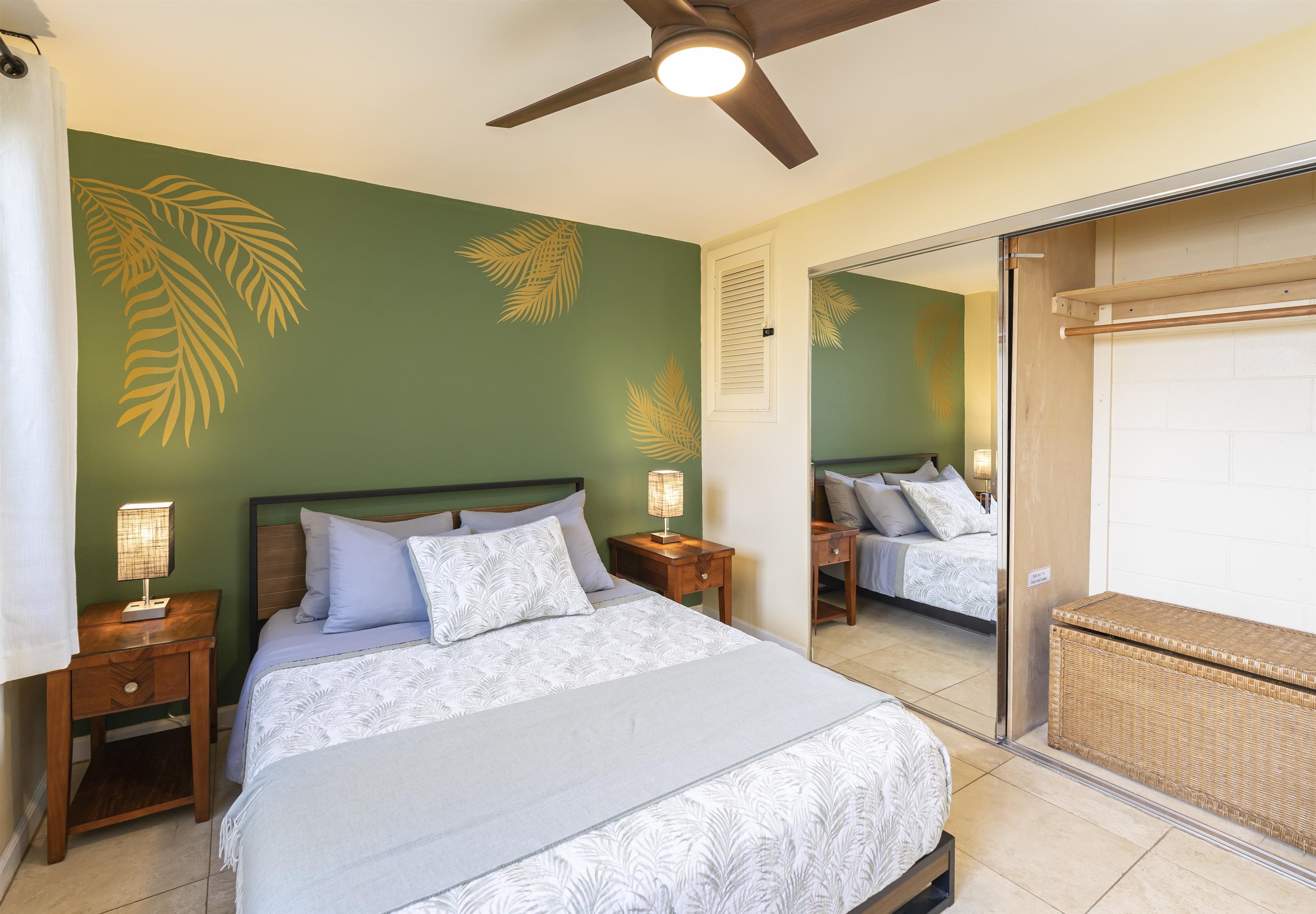 2495 South Kihei Road, Unit 137 Kihei, HI 96753 - Photo 9 of 17 a bedroom with a bed and a chandelier