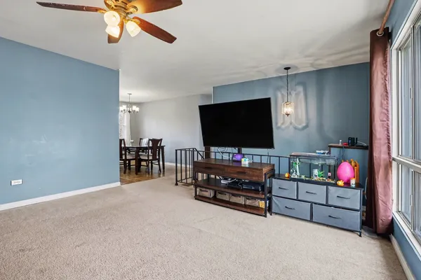 a room with furniture and flat screen tv