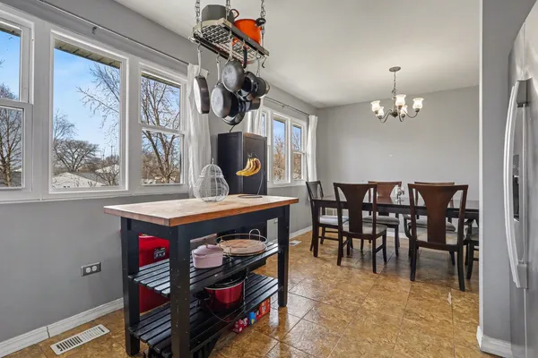 a view of a dining room with furniture window and chandelier