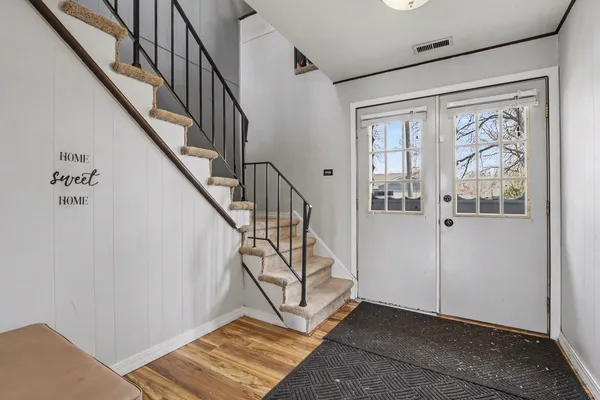 a view of an entryway with staircase