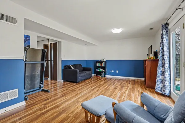 a bedroom with a bed and dresser