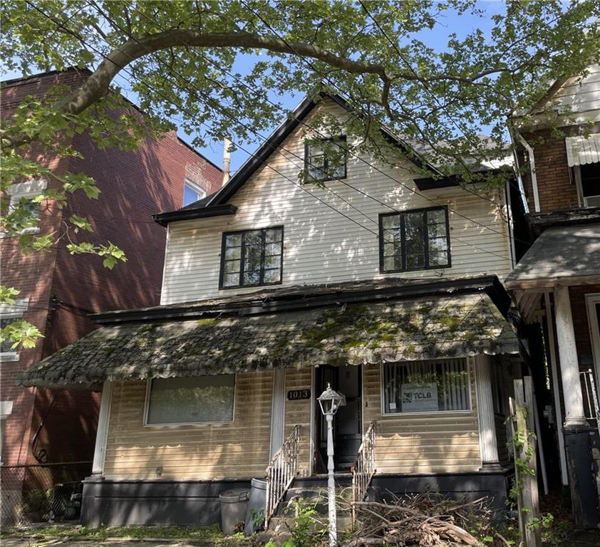 a front view of a house with parking