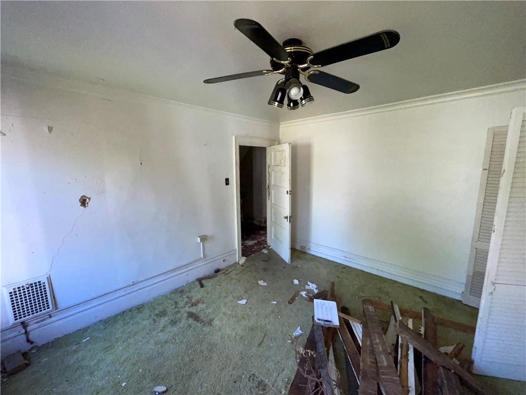 1013 4th Street Braddock, PA 15104 - Photo 9 of 16 a view of a hallway with a ceiling fan