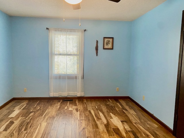 2280 Timber Ridge Drive Princeton, IL 61356 - Photo 9 of 20 an empty room with wooden floor and windows