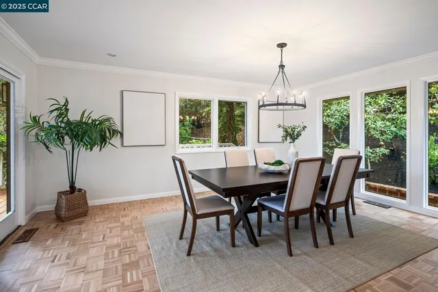 a view of a dining room with furniture window and outside view