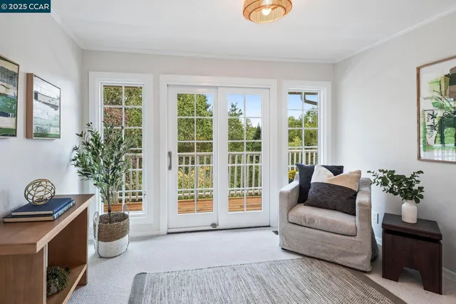 a living room with furniture and windows