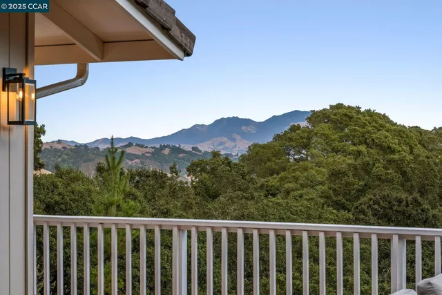 a view of a mountain from a balcony