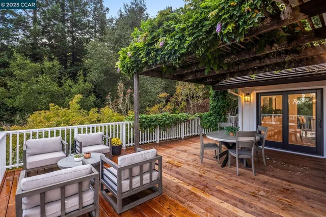 an outdoor patio with chairs and a table