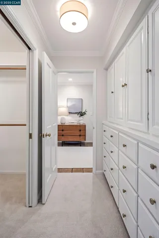 a view of kitchen with cabinets