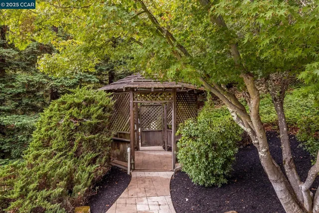a view of roof deck with wooden floor and outdoor seating