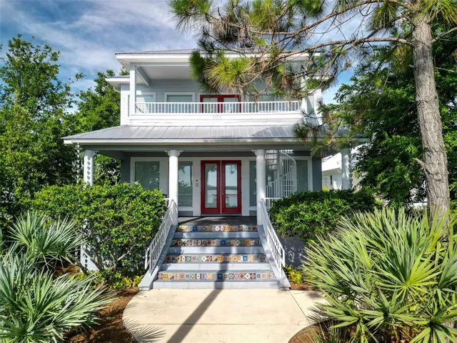 an aerial view of a houses with ocean view