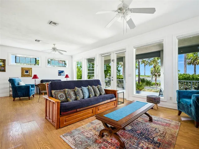 a bedroom with furniture and a flat screen tv