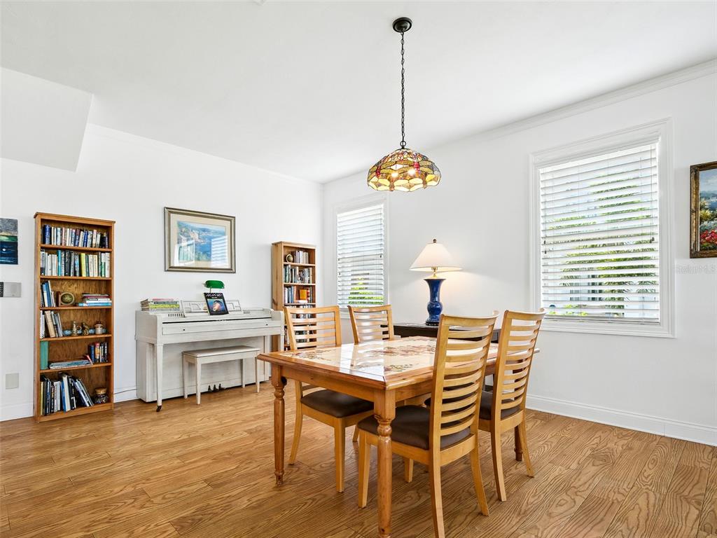 206 South Riverside Drive Edgewater, FL 32132 - Photo 17 of 60 a view of a dining room with furniture and wooden floor