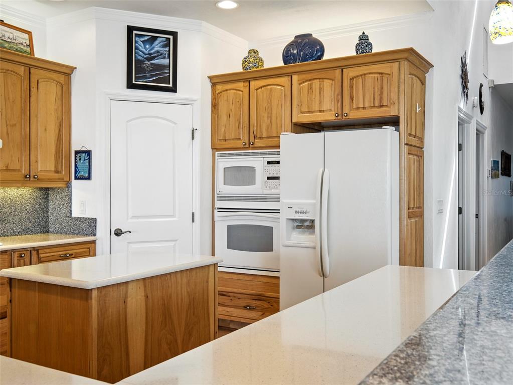 206 South Riverside Drive Edgewater, FL 32132 - Photo 21 of 60 a kitchen with stainless steel appliances a refrigerator and a stove