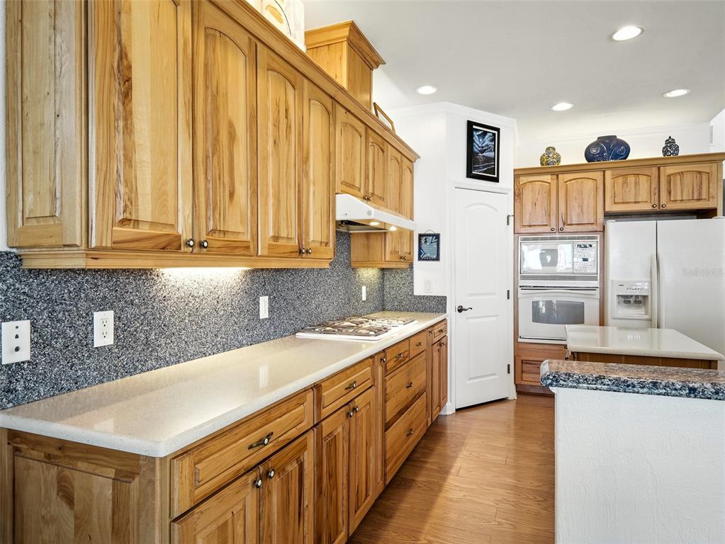 206 South Riverside Drive Edgewater, FL 32132 - Photo 22 of 60 a kitchen with stainless steel appliances granite countertop a stove a sink and a refrigerator