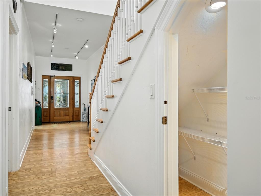 206 South Riverside Drive Edgewater, FL 32132 - Photo 26 of 60 a view of a hallway with wooden floor and staircase