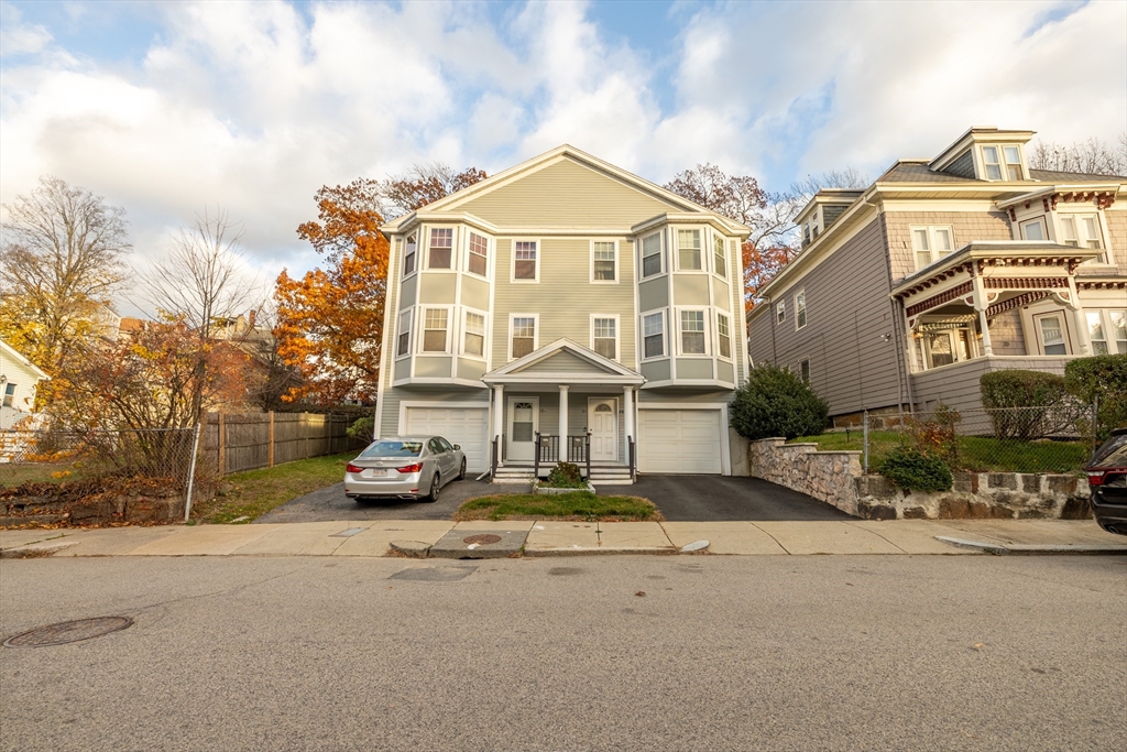 18 Sargent Street, Unit B Boston, MA 02125 - Photo 8 of 8 front view of a building with a garden