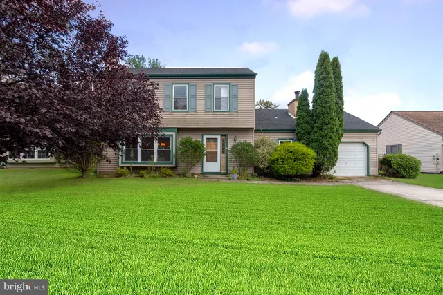 front view of a house with a garden