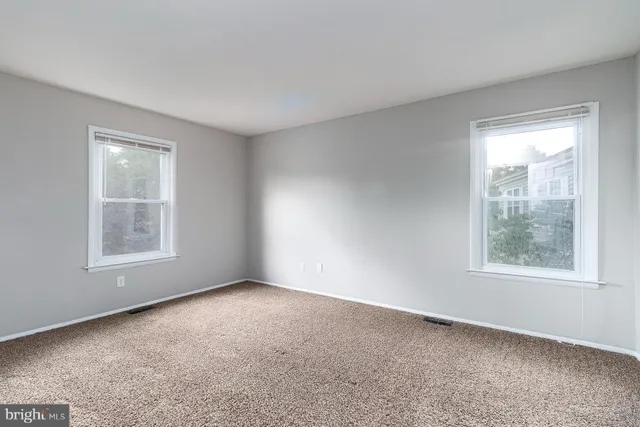 an empty room with windows