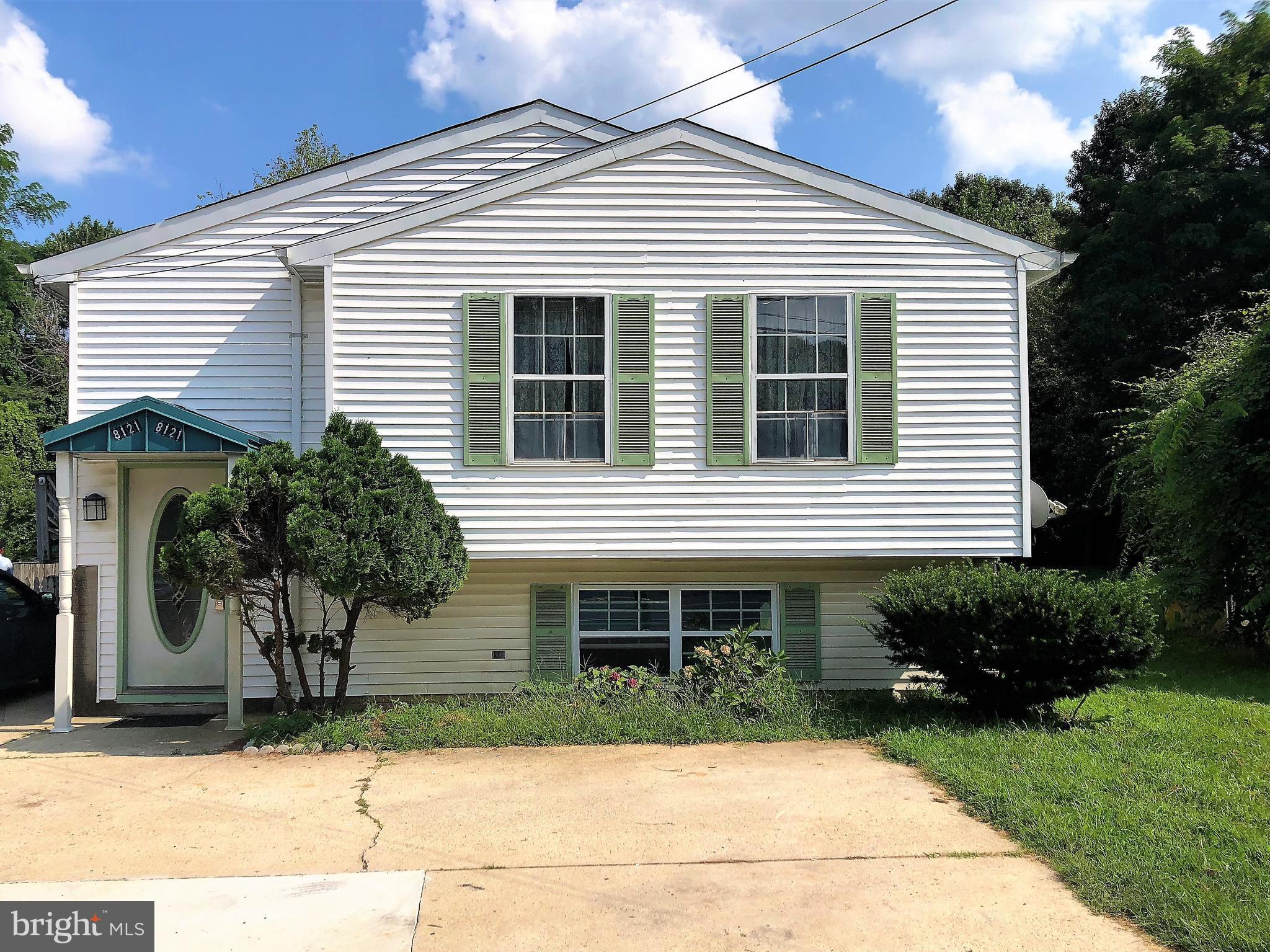 8121 Hog Neck Road Pasadena, MD 21122 - Photo 7 of 8 a front view of a house with garden